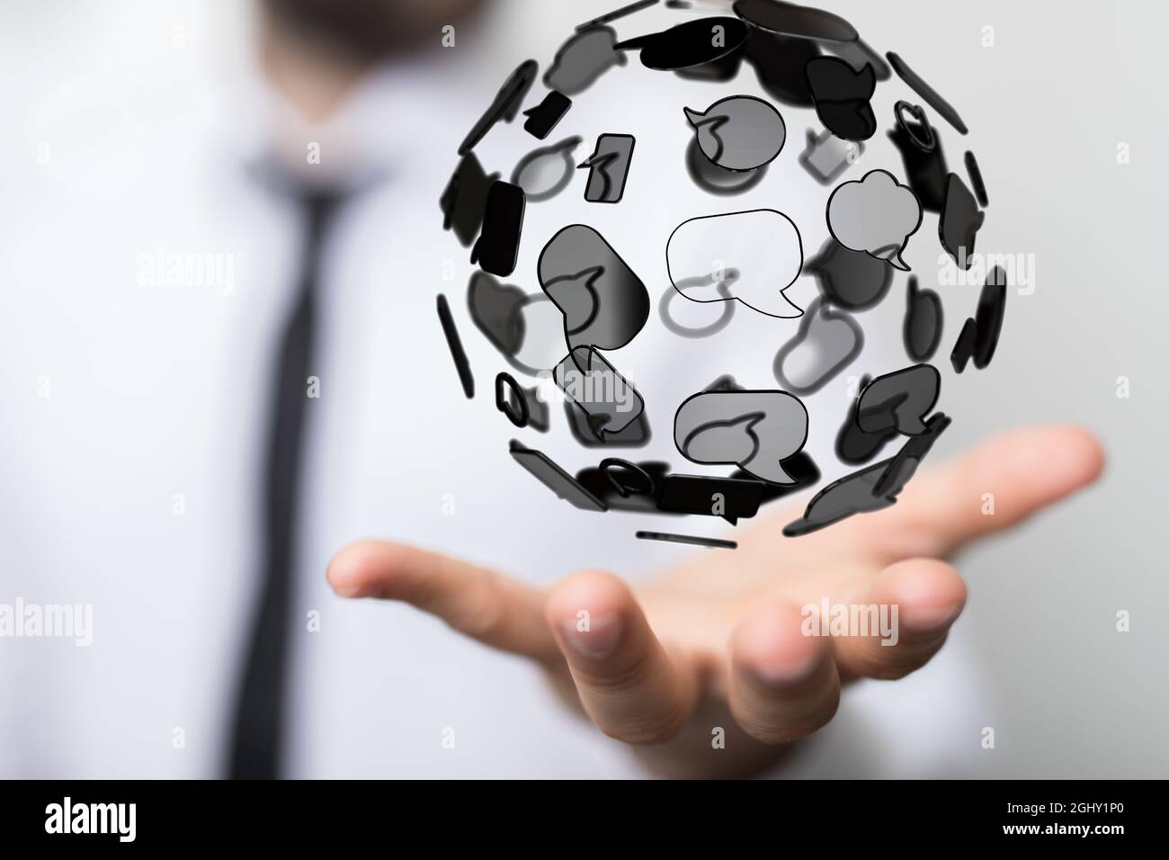 3D rendered globe with speech bubbles hovering over a man's hand Stock ...