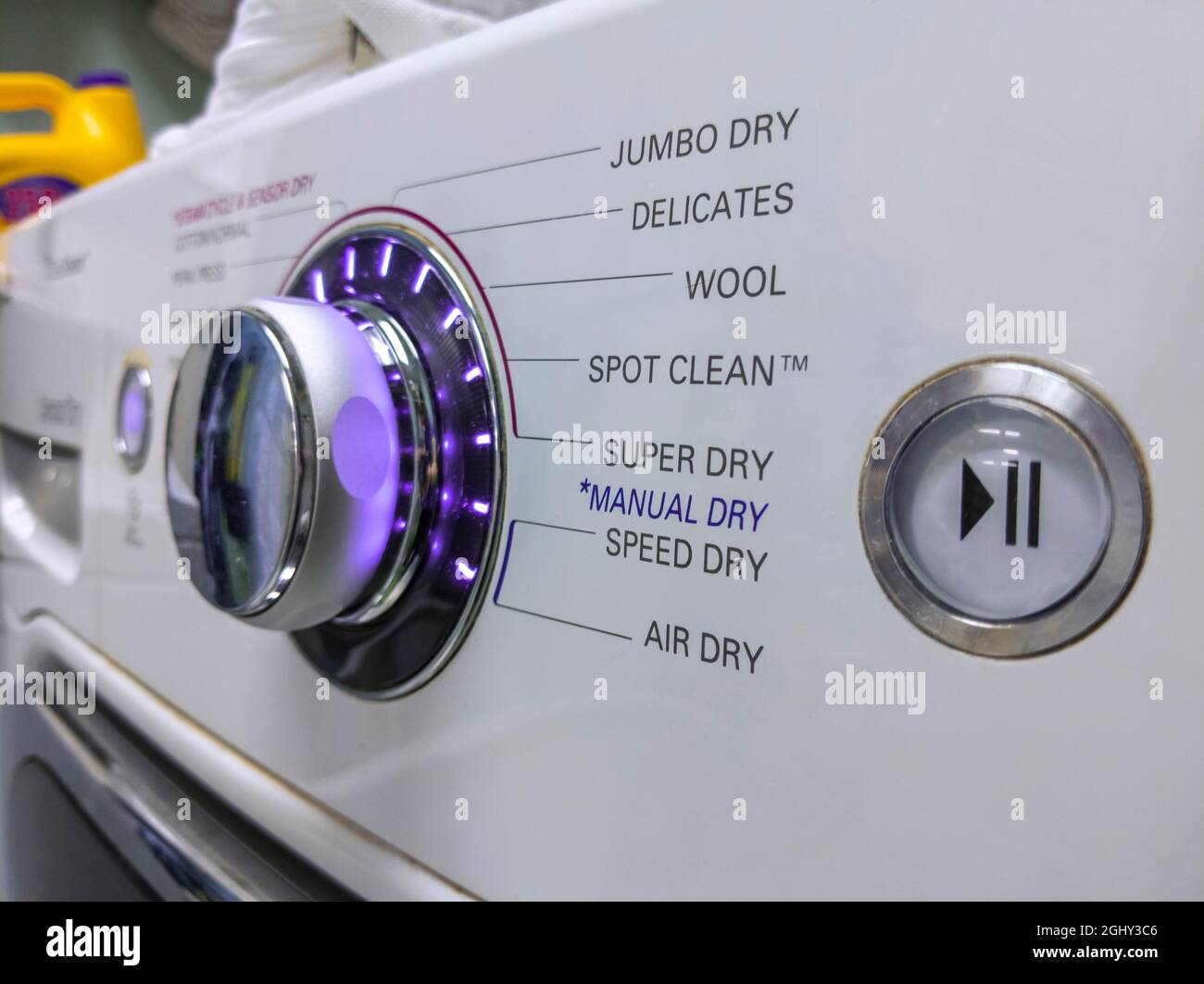 Close up of a knob on a clothing dryer control panel Stock Photo