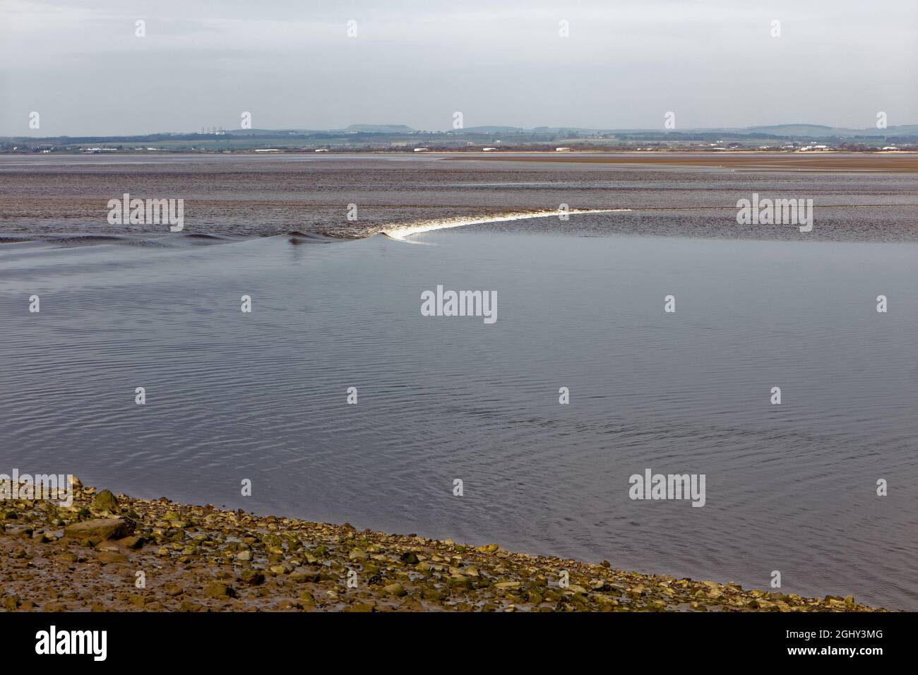 The Solway Bore passing Drumburgh Stock Photo