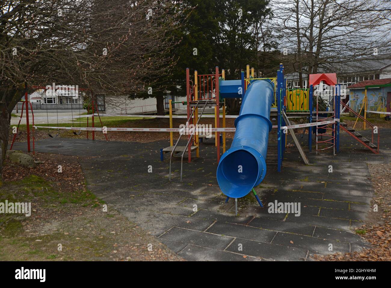 REEFTON, NEW ZEALAND, SEPTEMBER 6, 2021: Signage and barriers warn children away from a public playground during the Covid 19 lockdown in New Zealand, September 6,  2021 Stock Photo