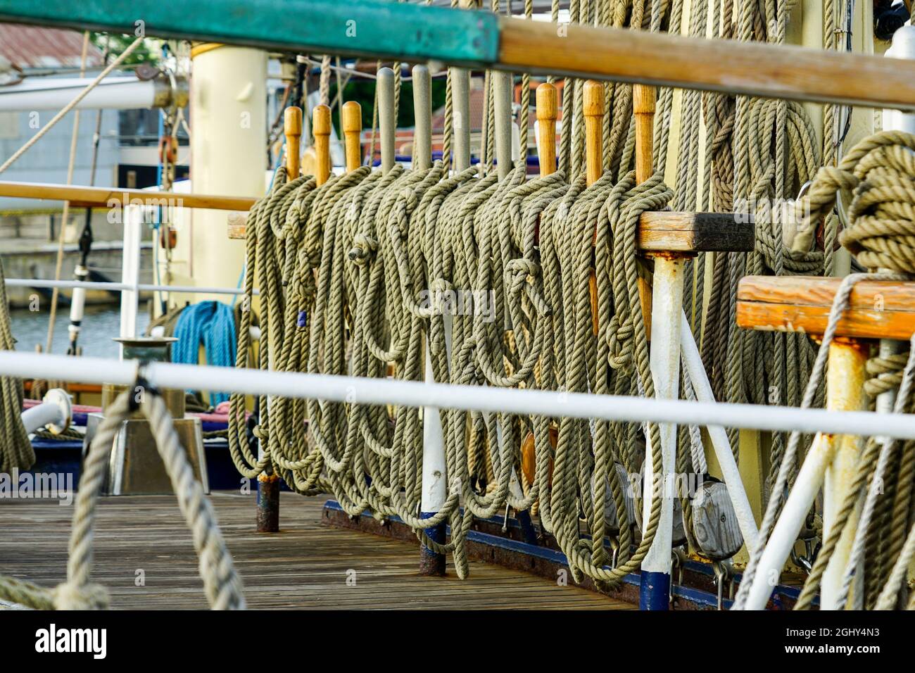 view of a rigging fragment of a historic sailing ship with lots of ...