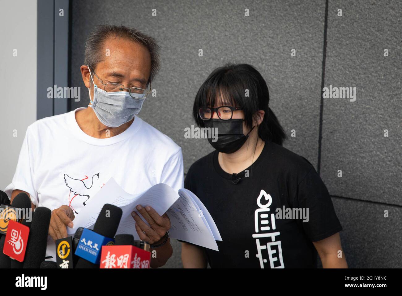 The Vice-chairwoman of Hong Kong Alliance, Chow Hang-Tung is seen consulting with a standing committee member before handing in their rejection letter to national security police.Standing committee members of the Hong Kong Alliance in Support of Patriotic Democratic Movements of China have rejected information request on its membership, finances and operations, and went to Hong Kong Police Headquarters to officially hand in their rejection letter. The secretary of security Chris Tang Ping-keung later spoke to the press this afternoon on the issue, claiming officials will take legal action soon Stock Photo