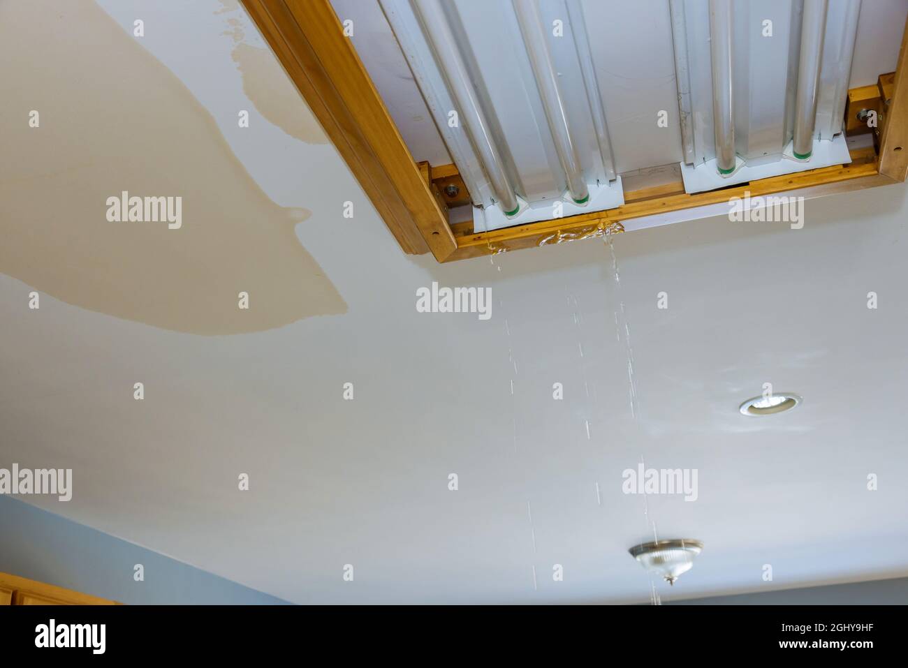 Broken light falling from the ceiling hires stock photography and images Alamy