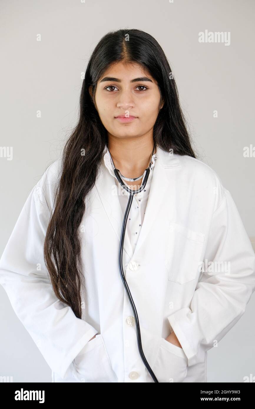 Young Indian female doctor wearing white coat and stethoscope Stock ...