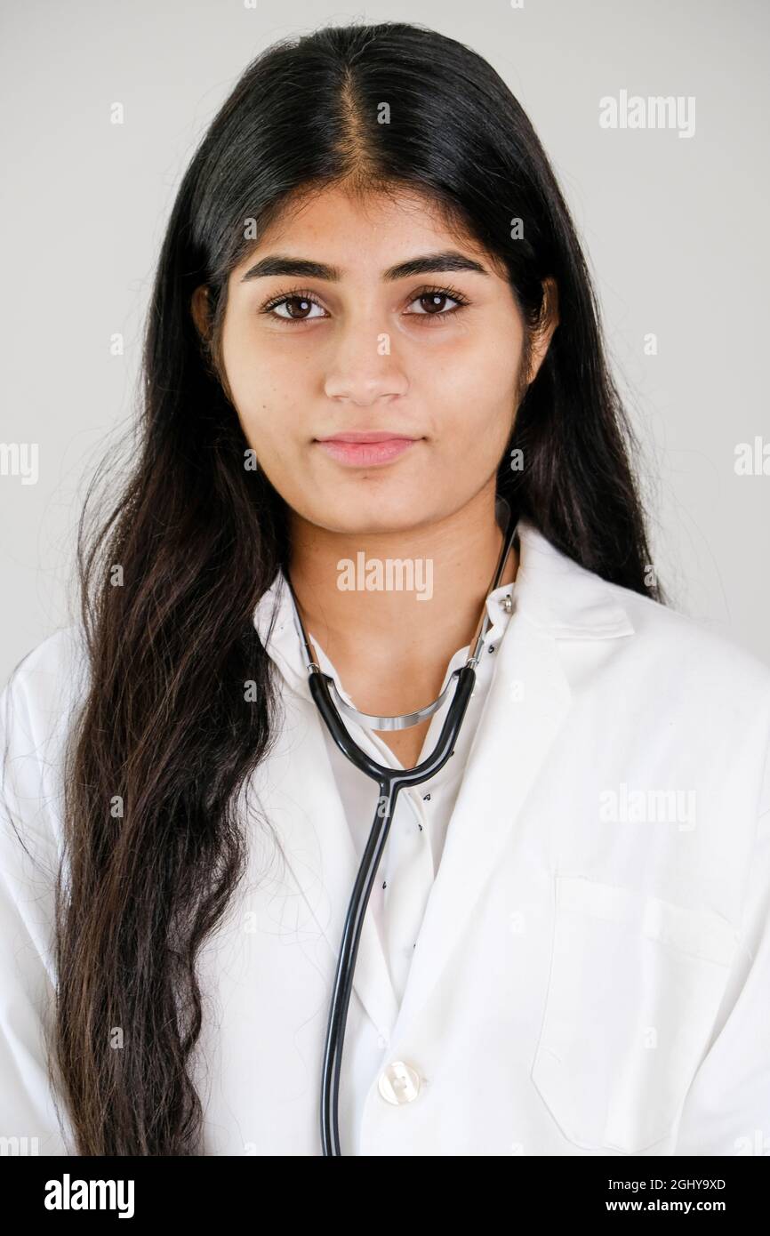 Young Indian female doctor wearing white coat and stethoscope Stock ...