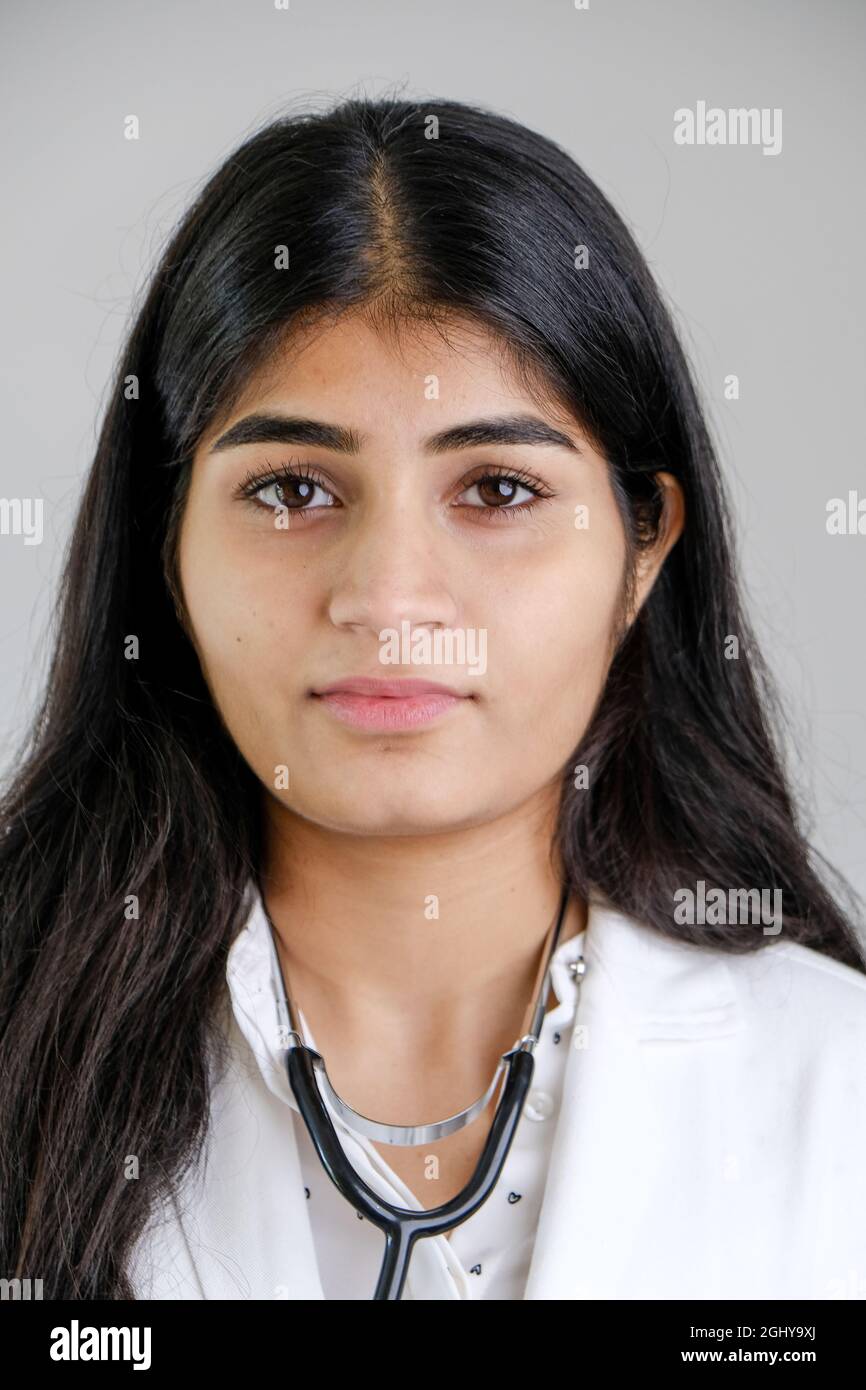 Young Indian female doctor wearing white coat and stethoscope Stock ...
