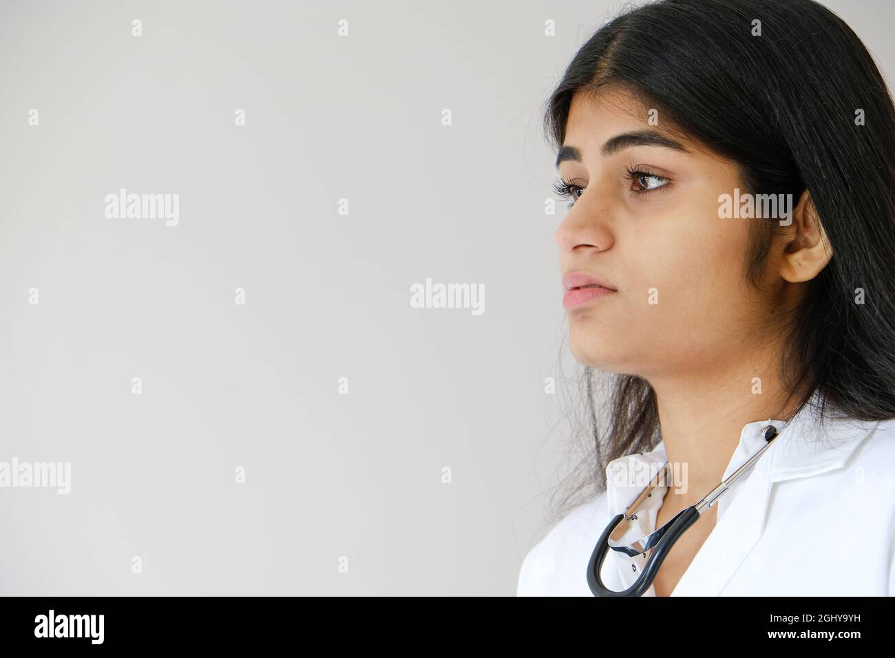 Young Indian female doctor wearing white coat and stethoscope Stock ...