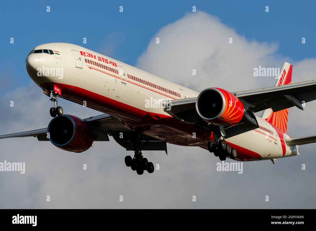 Air India Boeing 777 jet airliner plane VT-ALM on finals to land at London Heathrow Airport, UK. Indian flag carrier airline Stock Photo