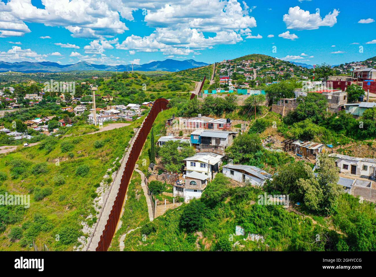 Aerial view of the border wall in Nogales Sonora (R) in Mexico and