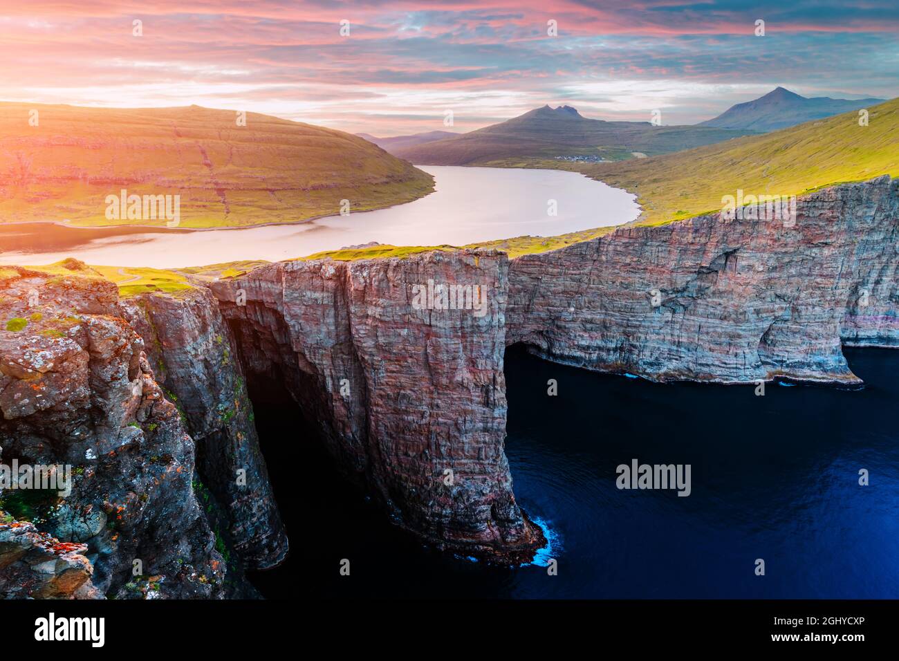 Incredible view of Sorvagsvatn lake on cliffs of Vagar island in sunset ...