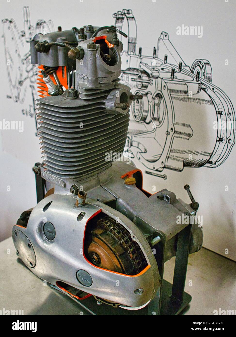 cut away detail of a motorcycle engine with line drawing im background Stock Photo