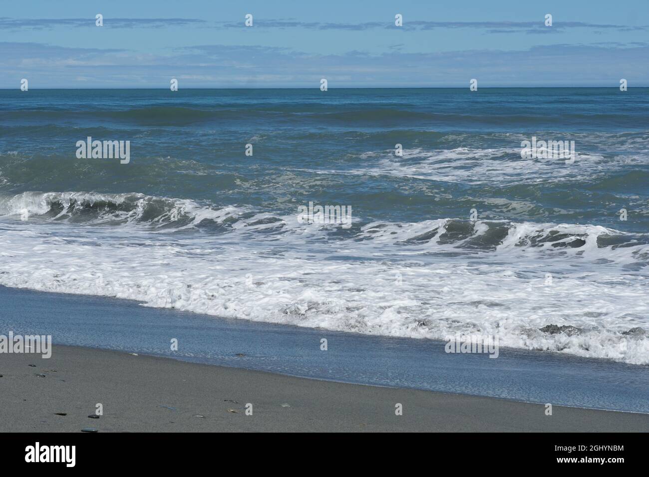 Sea sand and waves at the beach Stock Photo