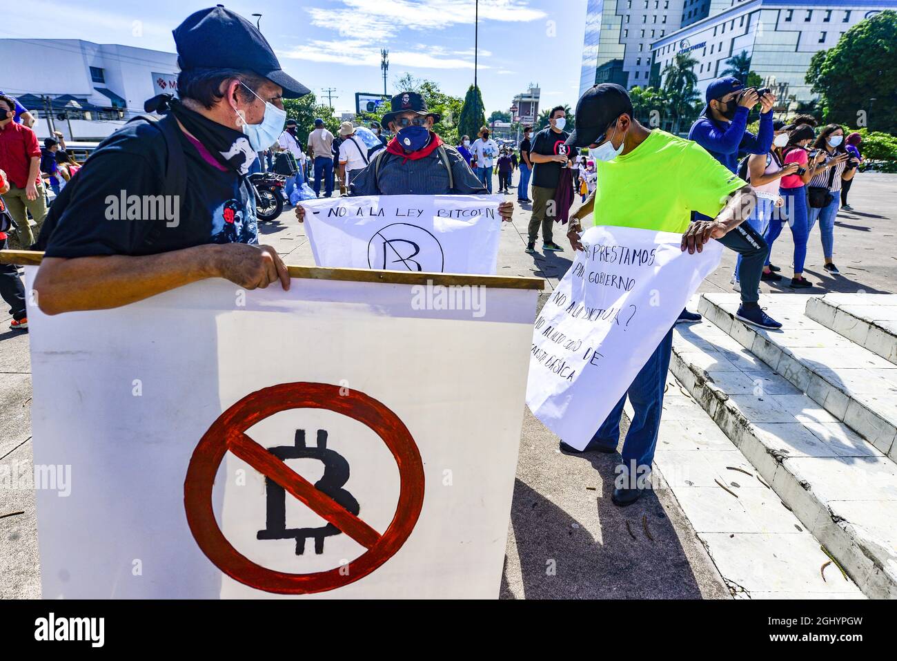 San Salvador, El Salvador. 07th Sep, 2021. A drag transgender demonstrator  is seen with an anti-bitcoin sign body paint while holding a placard during  the demonstration.Thousands of Salvadorans took to the street