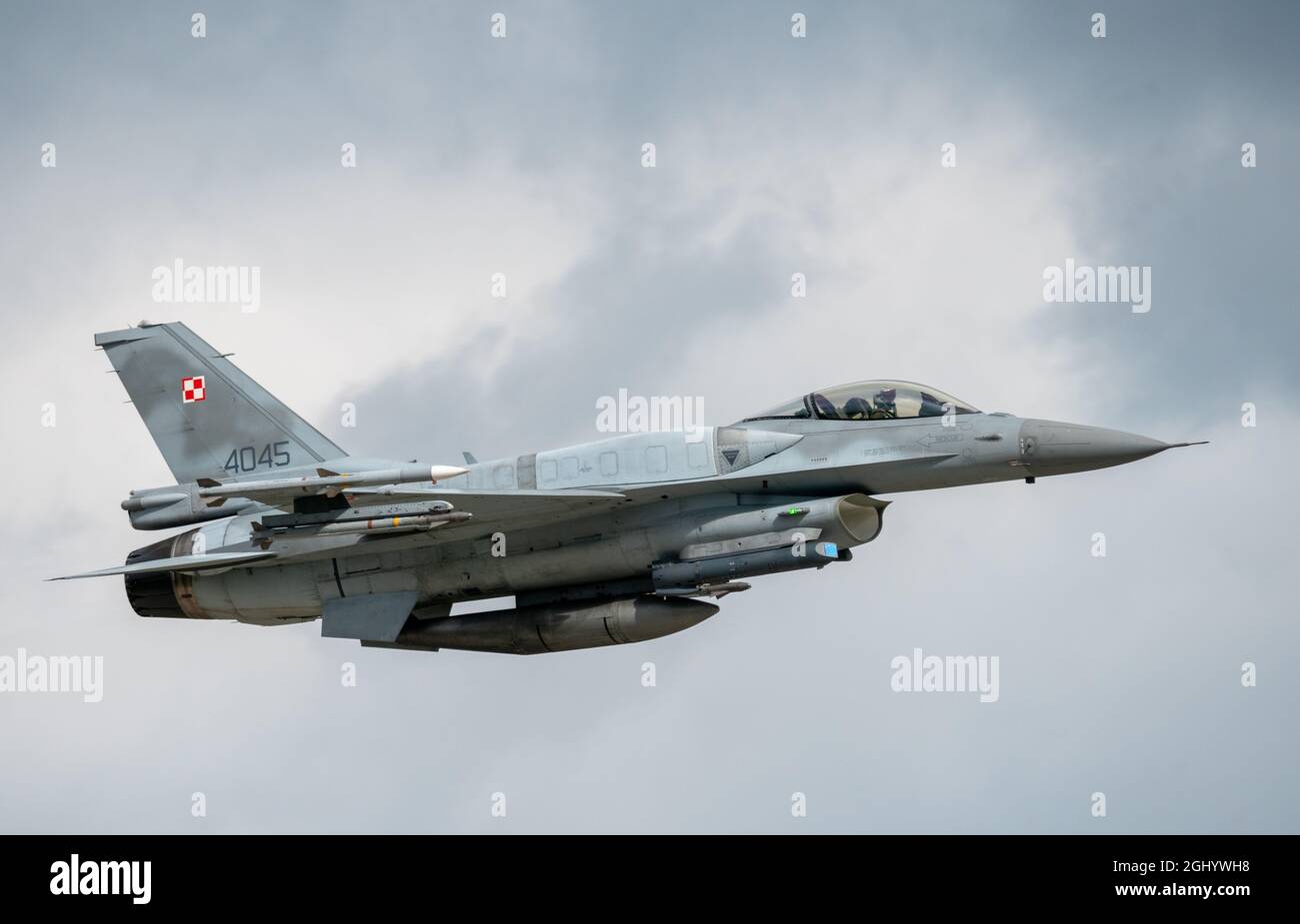 Lockheed Martin F- 16c (Block 52 Advanced) Polish Air Force in flight with air-air arming and additional tanks Stock Photo