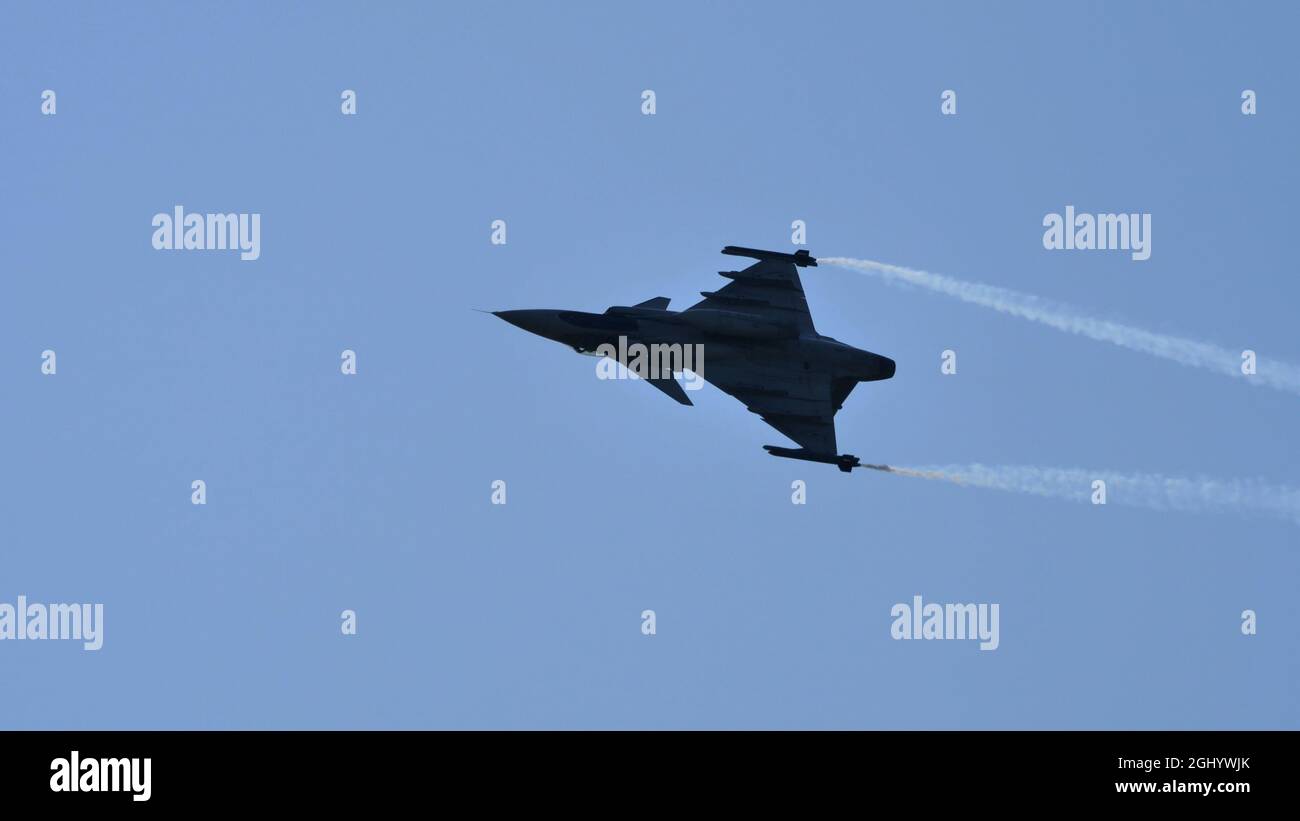 Maribor Slovenia AUGUST, 15, 2021 Aircraft fighter jet black silhouette. SAAB JAS-39 Gripen of Hungarian Air Force Stock Photo