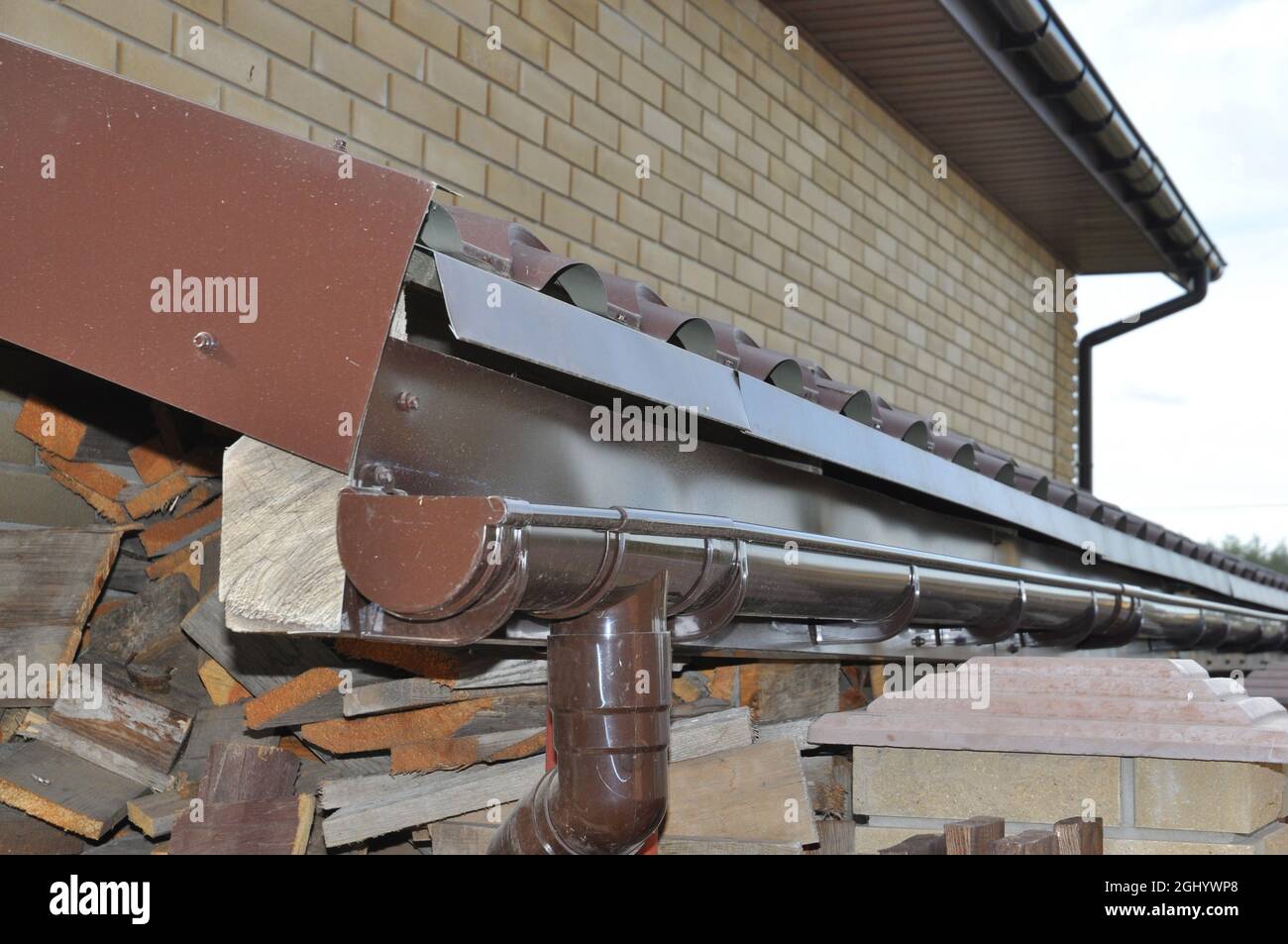 Roof guttering system is installed lower the roofline and is ended in