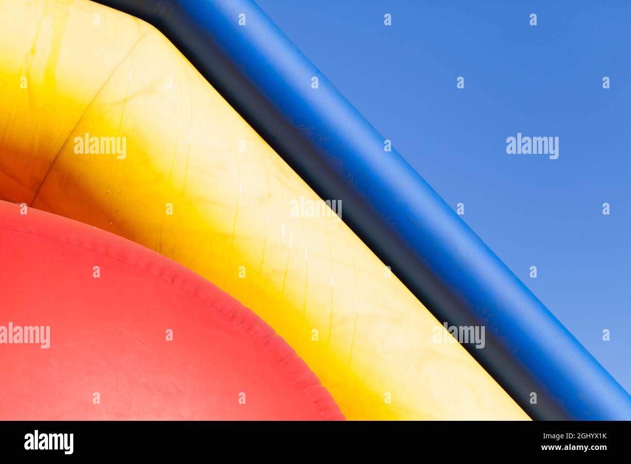 Abstract colorful photo, fragment of an inflatable slide in the water park Stock Photo