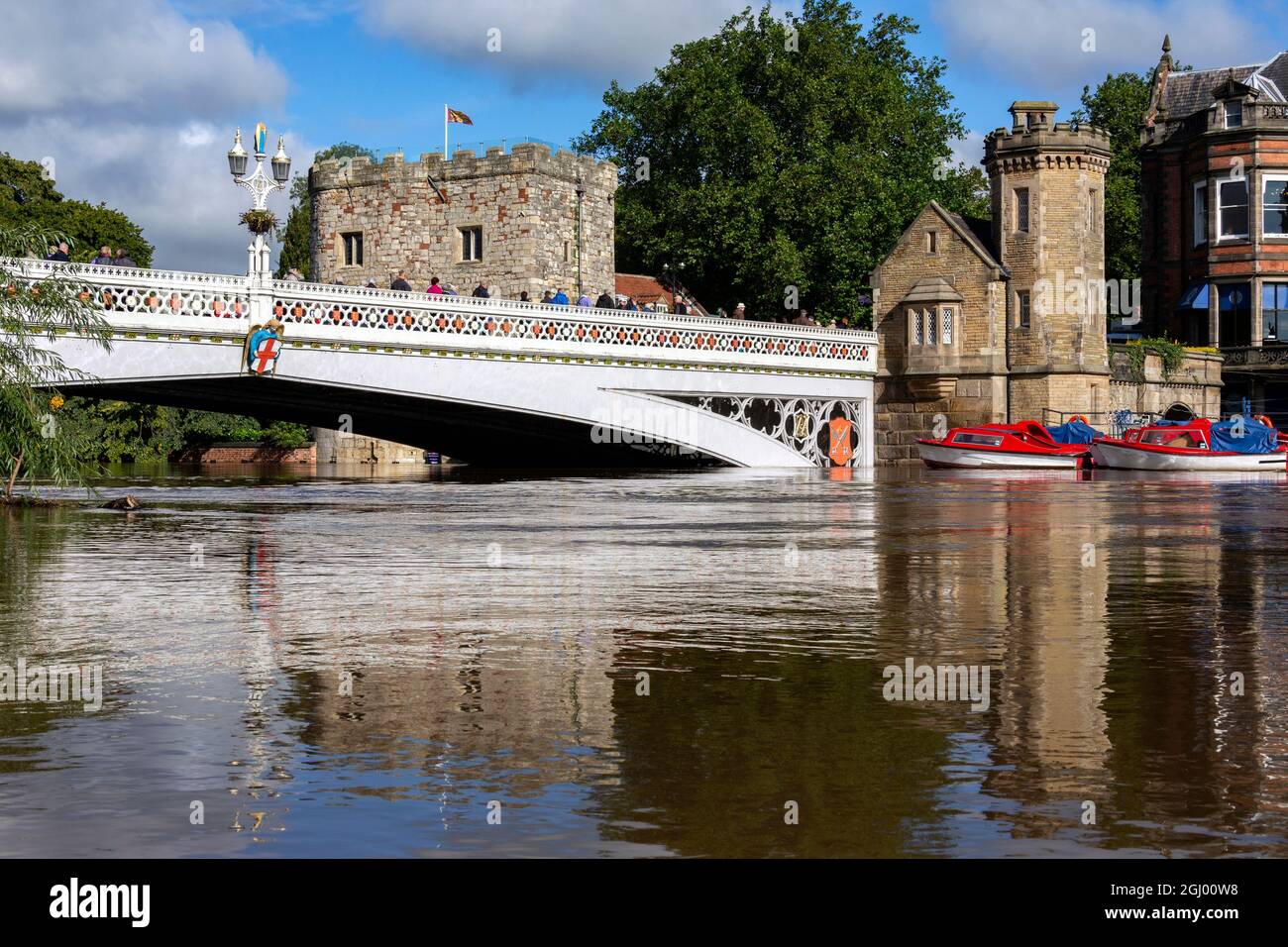 Lendal Bridge with the River Ouse at flood level. It is an iron bridge with details in the Gothic style popular in Victorian England. Stock Photo