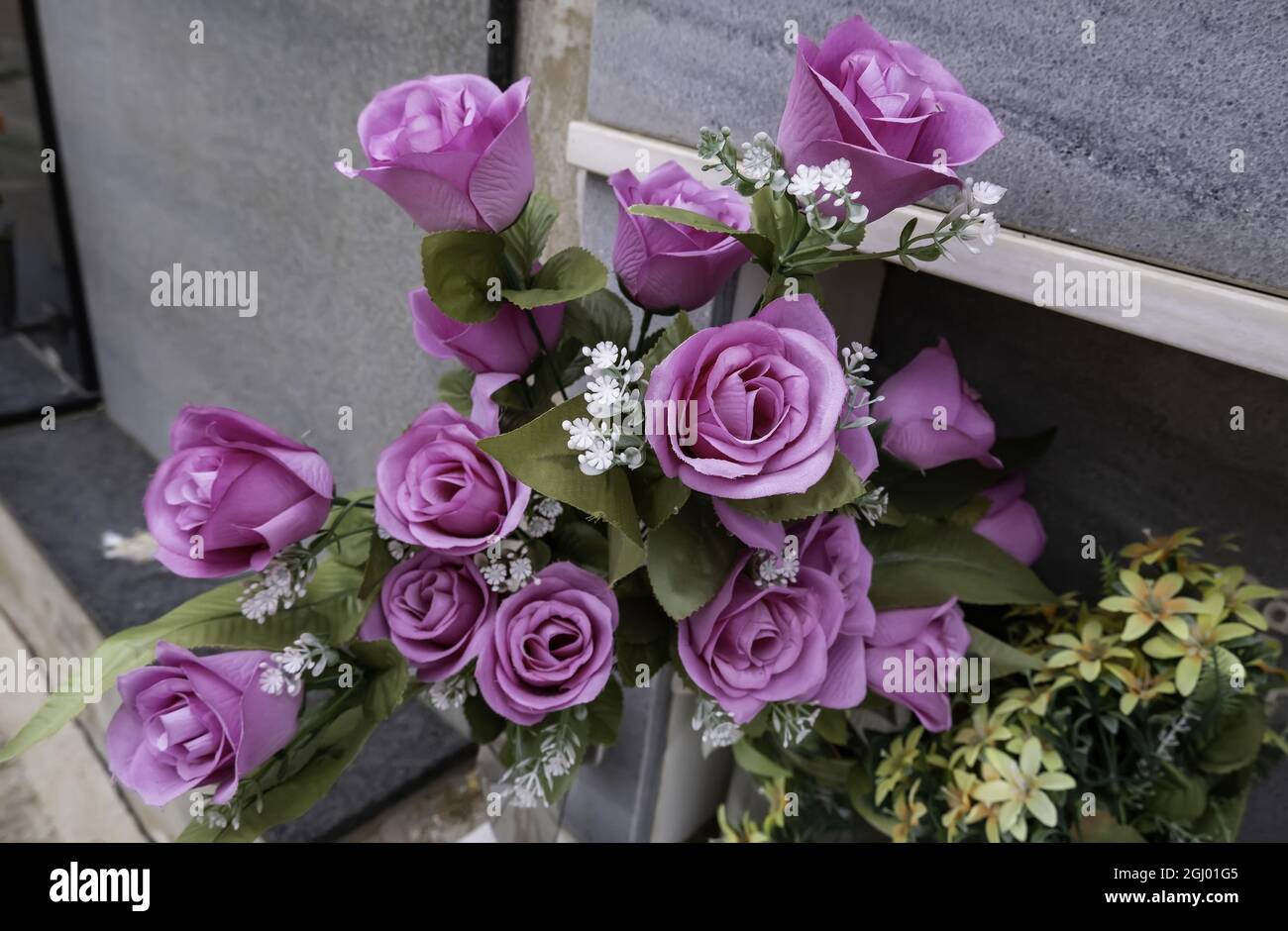 Detail of flowers on a grave, memory and sadness, death Stock Photo Alamy