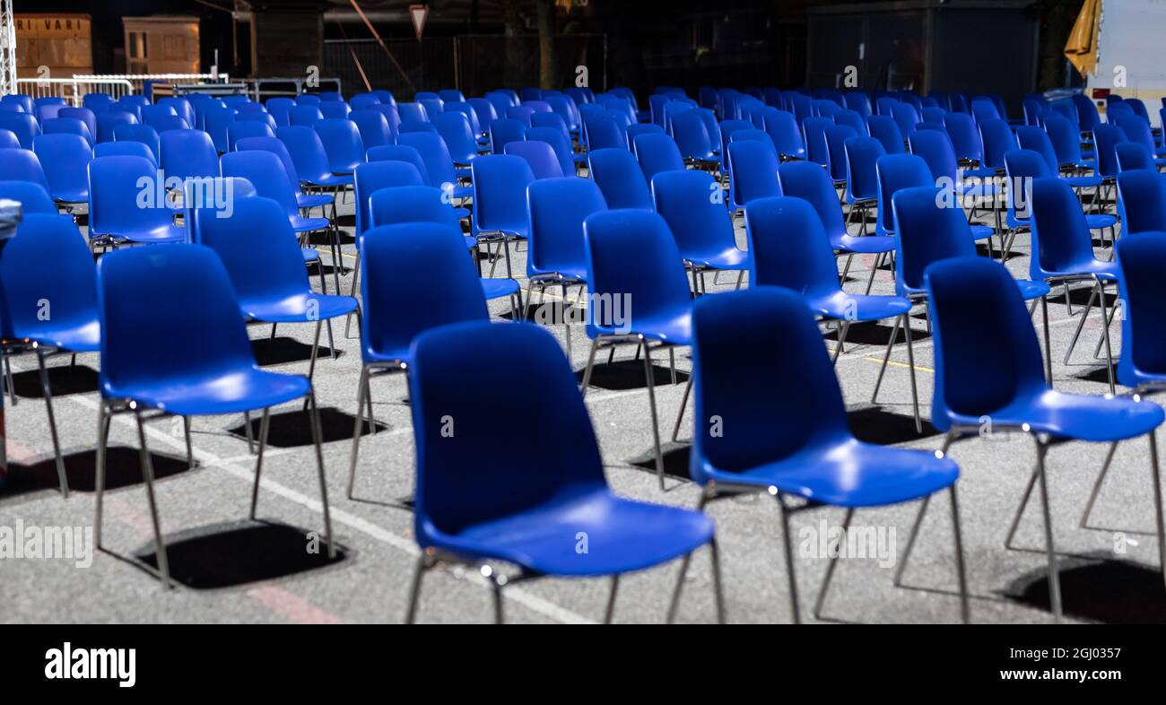 desolating rows of empty seats, in a place commonly used for outdoor performances now abandoned and waiting for the end of the pandemic, with the risk Stock Photo