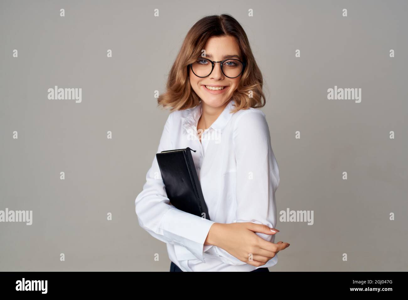 cheerful business woman secretary in white shirt documents work Stock ...