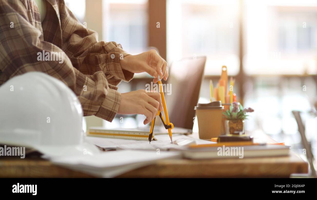 Engineers office project, Closeup, engineer architecture using divider