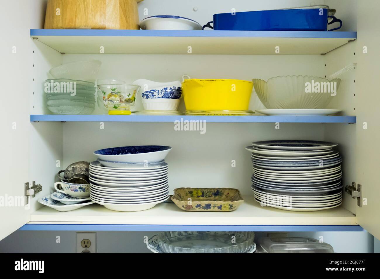 Typical old, used, mismatched everyday dishes, bowls stacked in a