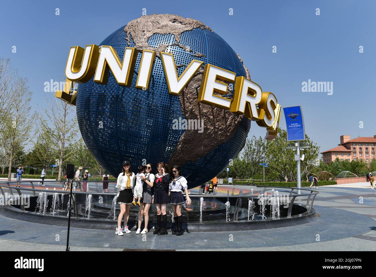 Tourists take pictures in front of the landmark of the universal theme  park. Universal Beijing Resort is a widely anticipated theme park  destination featuring several new attractions along with the best Universal