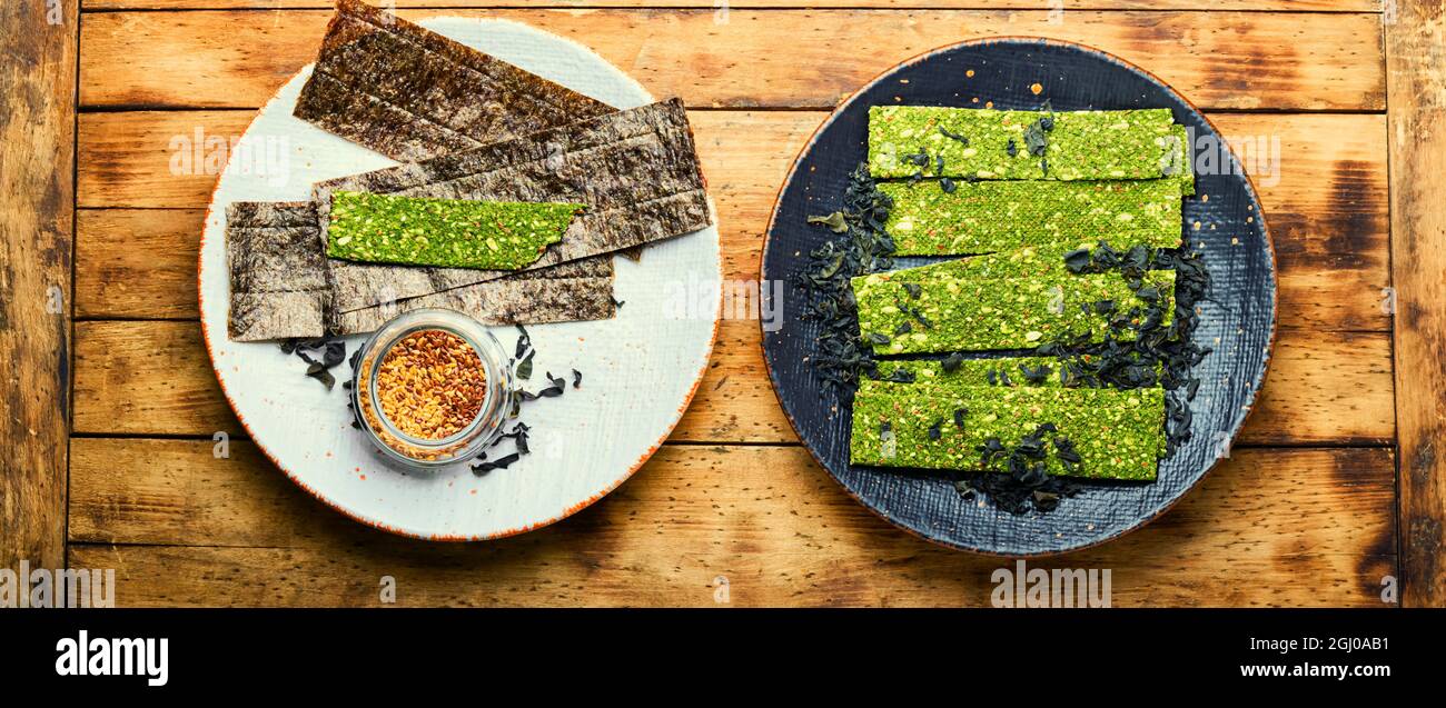 Seafood multi snack from kelp and spirulina. Algae chips. Vegan food