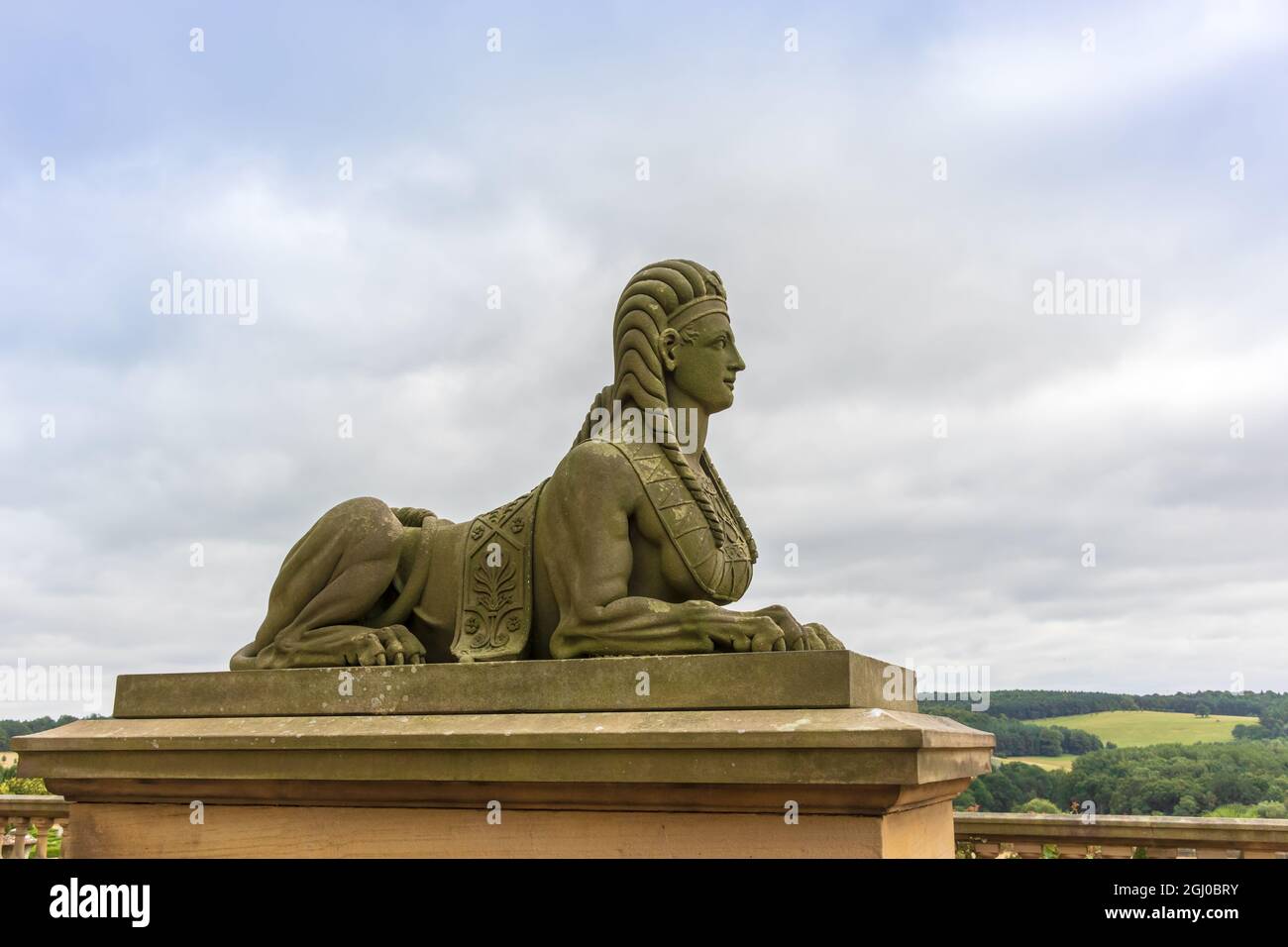 Antique stone carved sculpture of a sphinx, famous monument depicts the body of a lion with a human head in the gardens of Harewood House near Leeds. Stock Photo