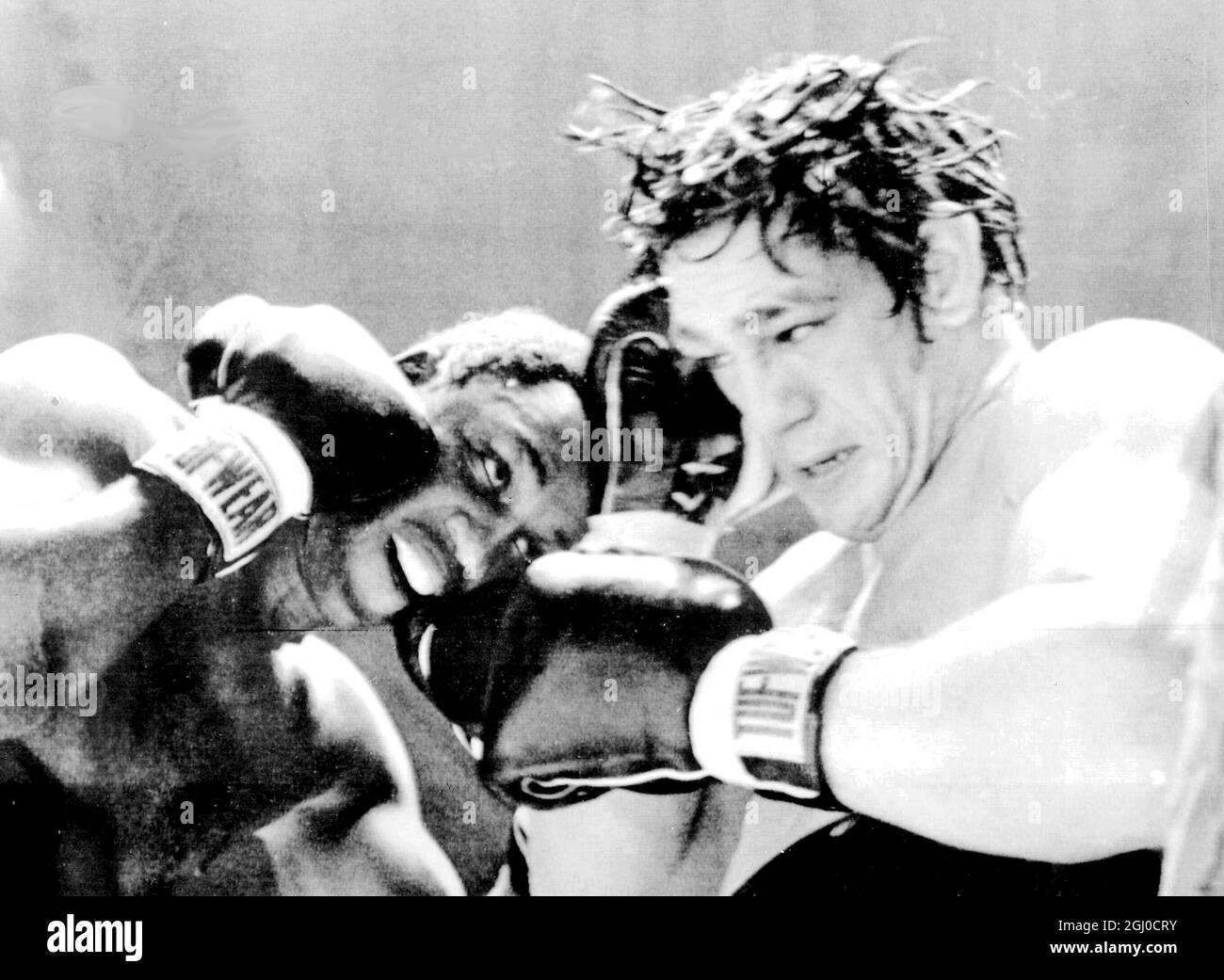 Joe Frazier retains his title, after fifteen rounds in a heavyweight championship fight against Oscar Bonavena. Philadelphia - 11th December 1968 Stock Photo