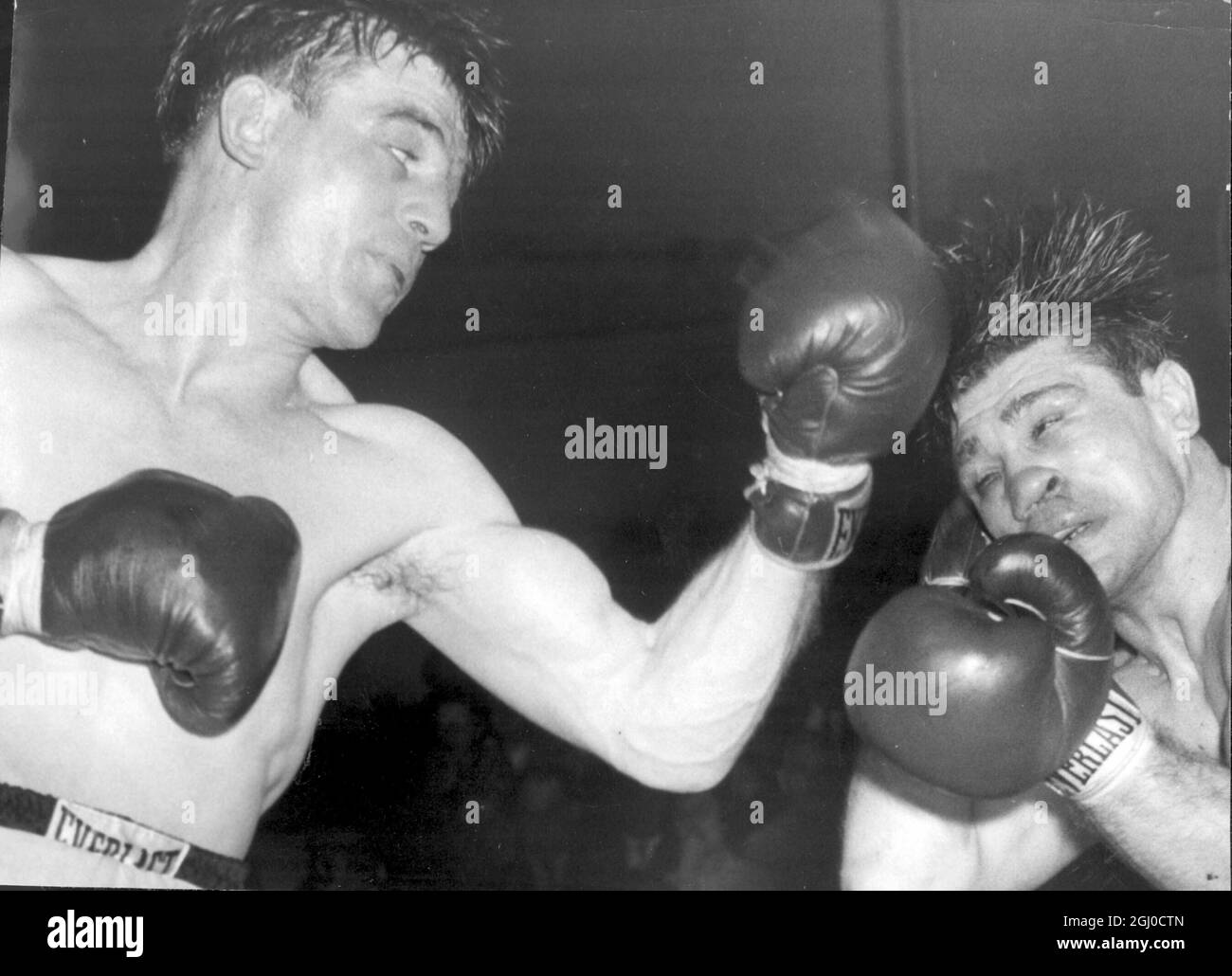 Johnny Sullivan is pictured here fighting Tony Johnson, who he knocked down in the ninth round of the British Middleweight. New York, USA 16th January 1958 Stock Photo