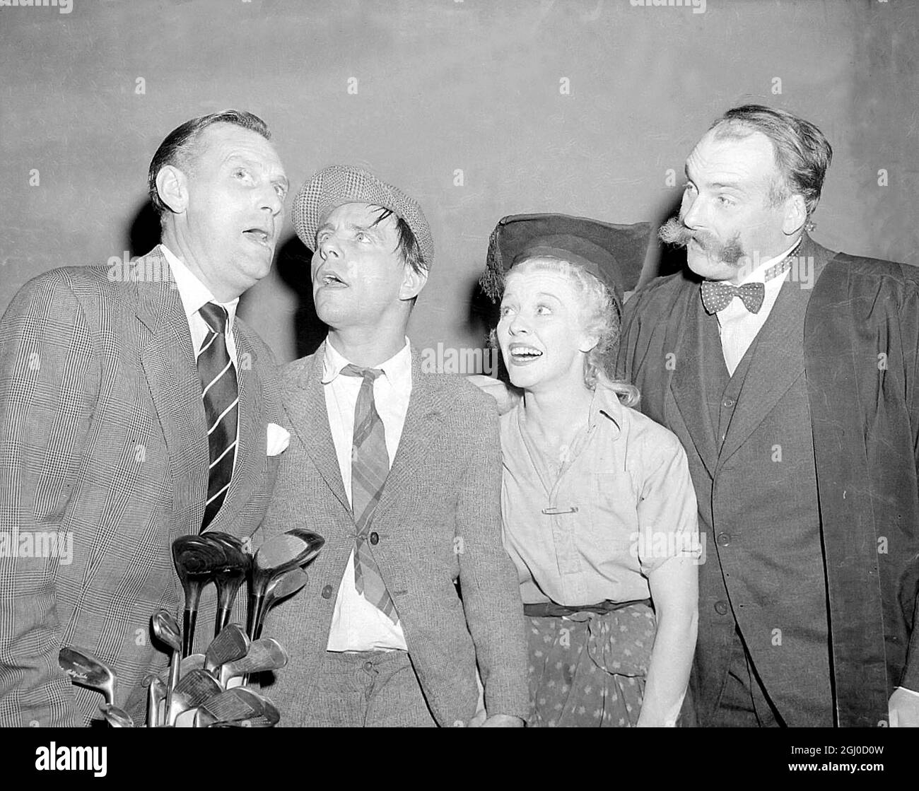 Comedy Quartet Left - Right - Al Read, Norman Wisdom, Sally Barnes, and ''Professor'' Jimmy Edwards rehearsing their parts for the television show ''For Your Pleasure'' at Lime Grove Studios in London. 28th October 1953 Stock Photo