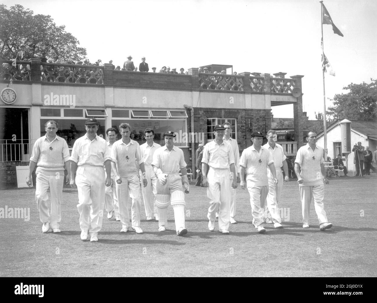 Colin Cowdrey leads the Kent side out to the field against Yorkshire. The players were L-R: D.J. Halfyard, Colin Cowdrey, S.E. Leary, P.H. Jones, R.W. Wilkinson, A.W. Catt, A.L. Dixon, A. Brown, R.C. Wilson, P.E. Richardson and F. Ridgeway. 25th May 1960. Stock Photo