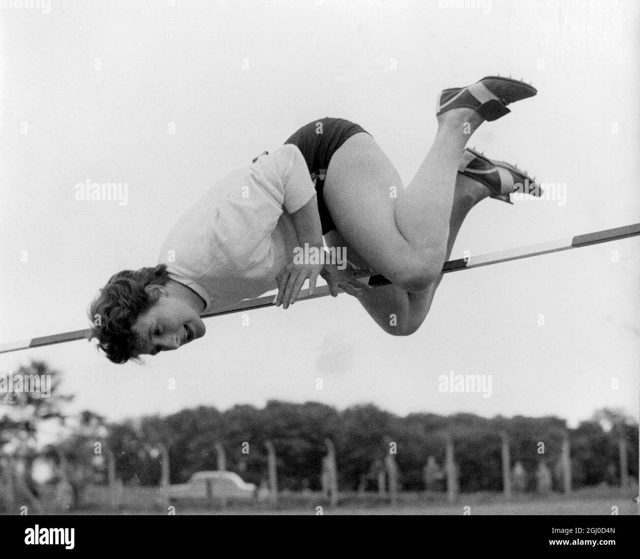 Over the top goes Olympic high jump star Thelma Hopkins, to win the competition for the Northern Women's Inter Counties A A Championships at Leeds. 27th May 1957 Stock Photo
