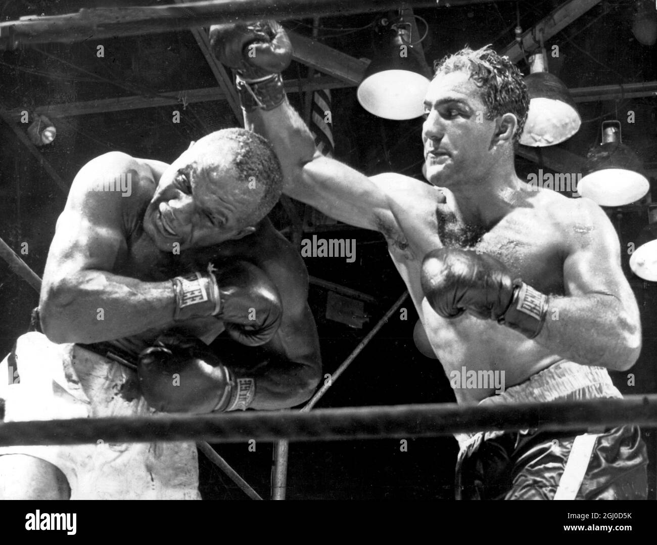 Rocky Marciano and Jersey Joe Walcott, fighting it out in the boxing