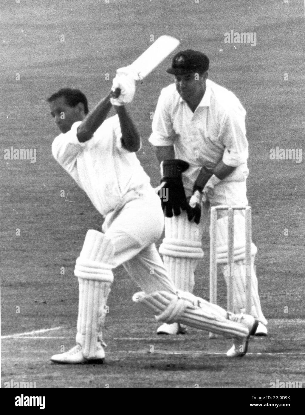England v Australia Basil D'Oliveira hitting out at a ball from Bob Cowper during England's second innings in the first Test at Old Trafford Barry Jarman is the wicket keeper 11th June 1968 Stock Photo
