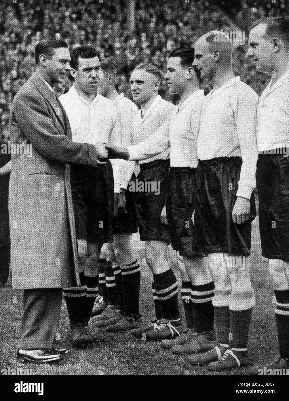 George VI shaking hands with Dixie Dean, captain of Everton before the FA Cup final. Stock Photo
