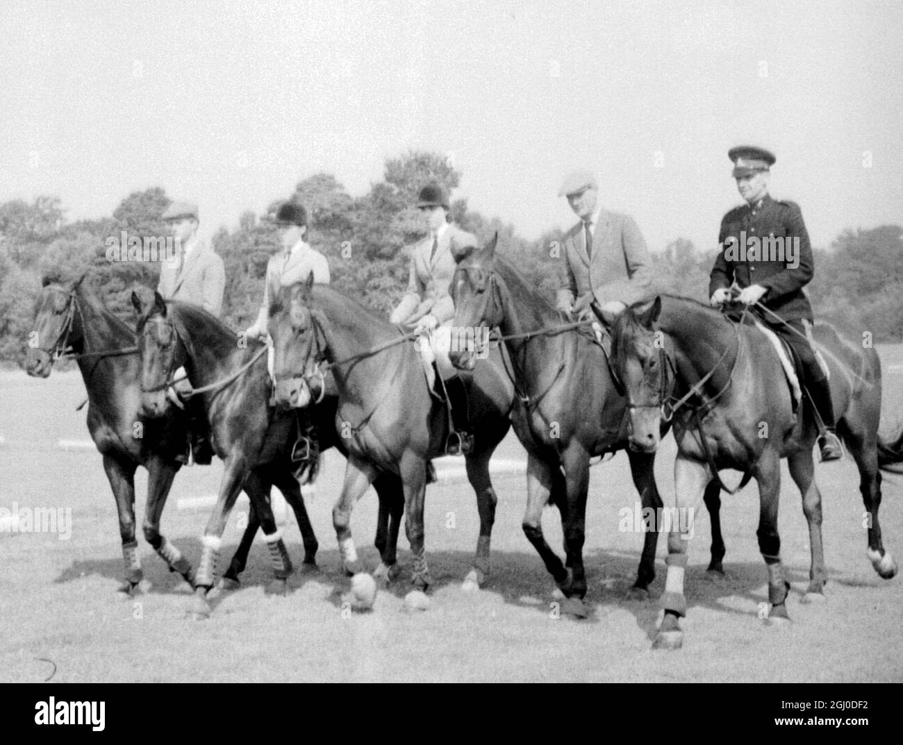 Members of the 1968 British Olympic team which won the gold medal in the three day equestrian team event. L-R: Mr. Richard Meade, Miss Christine Sheppard, Miss Mary MacDonell, Major Derek Allhusen and Sgt. Ben Jones. Pictured at a training session on Smith's Lawn, Windsor Great Park - 27th August 1965 Stock Photo