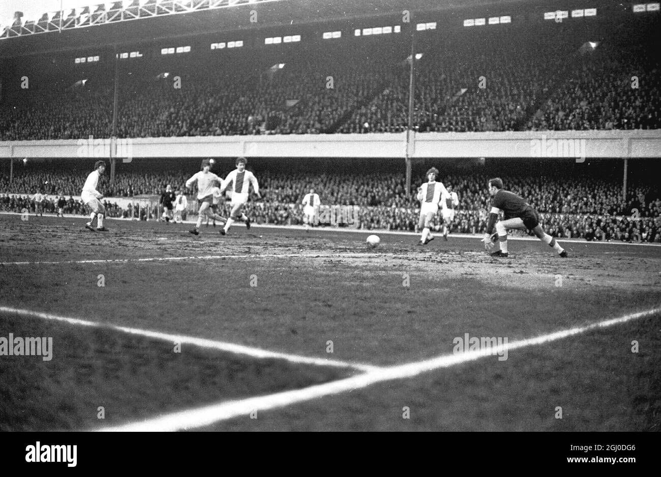 European Fairs Cup Semi-Final 1st Leg. Arsenal V Ajax Hulshoff (Ajax), (No.4 Centre) heads the ball clear during the match at Highbury. On the left is George Graham (Arsenal) and on the right is Suurbier (Ajax). On extreme right is Vasovic (Ajax). London - 8th April 1970. Stock Photo