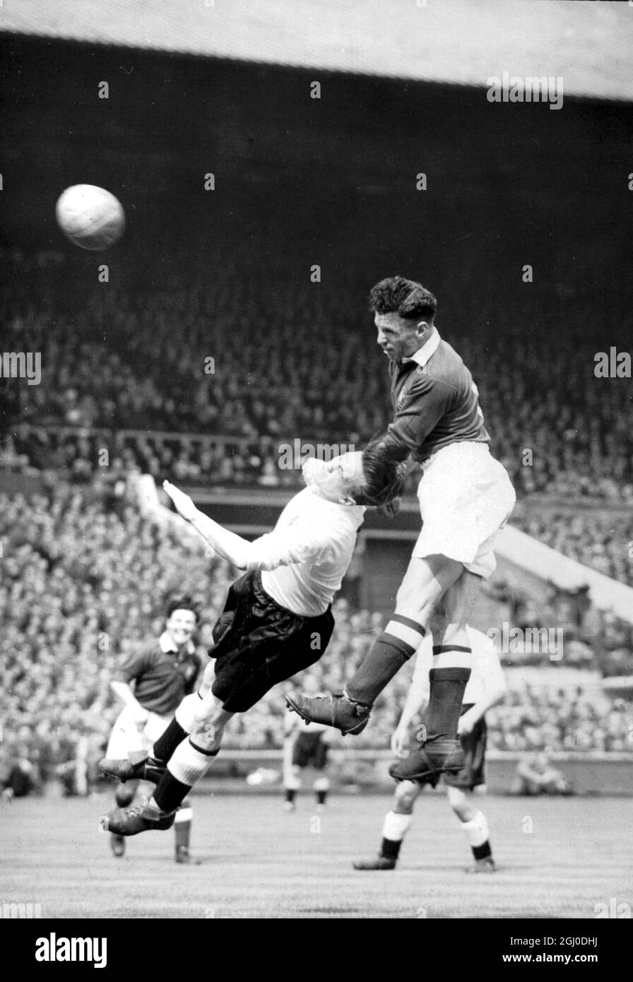 1948 FA Cup Final Manchester United v Blackpool Jack Rowley (dark shirt) of Manchester United challenges Hayward the Blackpool centre half as heads the ball towards the Blackpool goal during a corner kick. 24th April 1948. Stock Photo