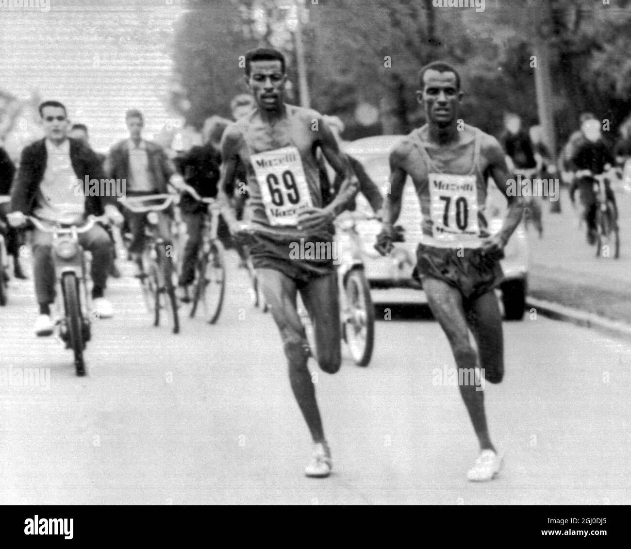 Ethiopia's champion marathon runner crosses the finish line in Stockholm, Sweden to set a new world record for the one hour run. He covered 20.226 meters in the time. The old record of 20.052.5 meters belonged to veteran World Champion Emil Zatopek. 28th May 1962. Stock Photo