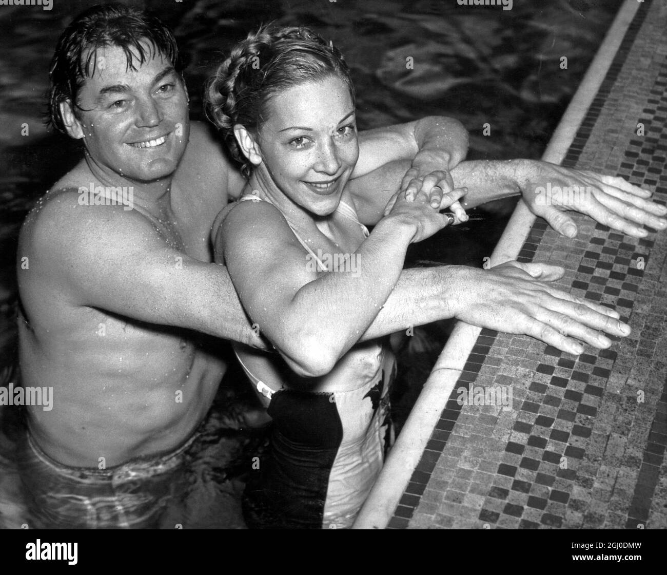 Johnny Weismuller and Belita at the Marshall Street Baths, practising for their display which is shortly to be seen at the Health and Holidays Exhibition, at Earls Court. 16th Febraury 1948. Stock Photo