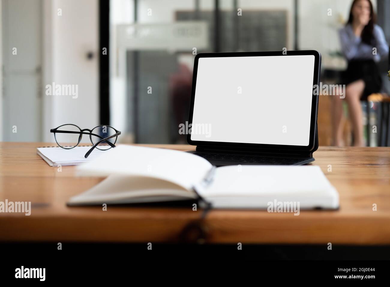 Shot of digital tablet with blank white screen, keyboard, cup of coffee on workspace desk Stock Photo