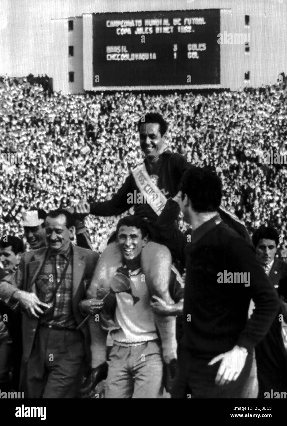 1962 World Cup Final Brazil v Czechoslovakia After placing a sash reading ''Miss World Cup'' around his chest, Brazilan soccer fans carry their country's goalkeeper Gilmar around the national stadium after Brazil's 3-1 defeat of Czechoslovakia in the final of the World Cup in Santiago, Chile. 18th June 1962 Stock Photo