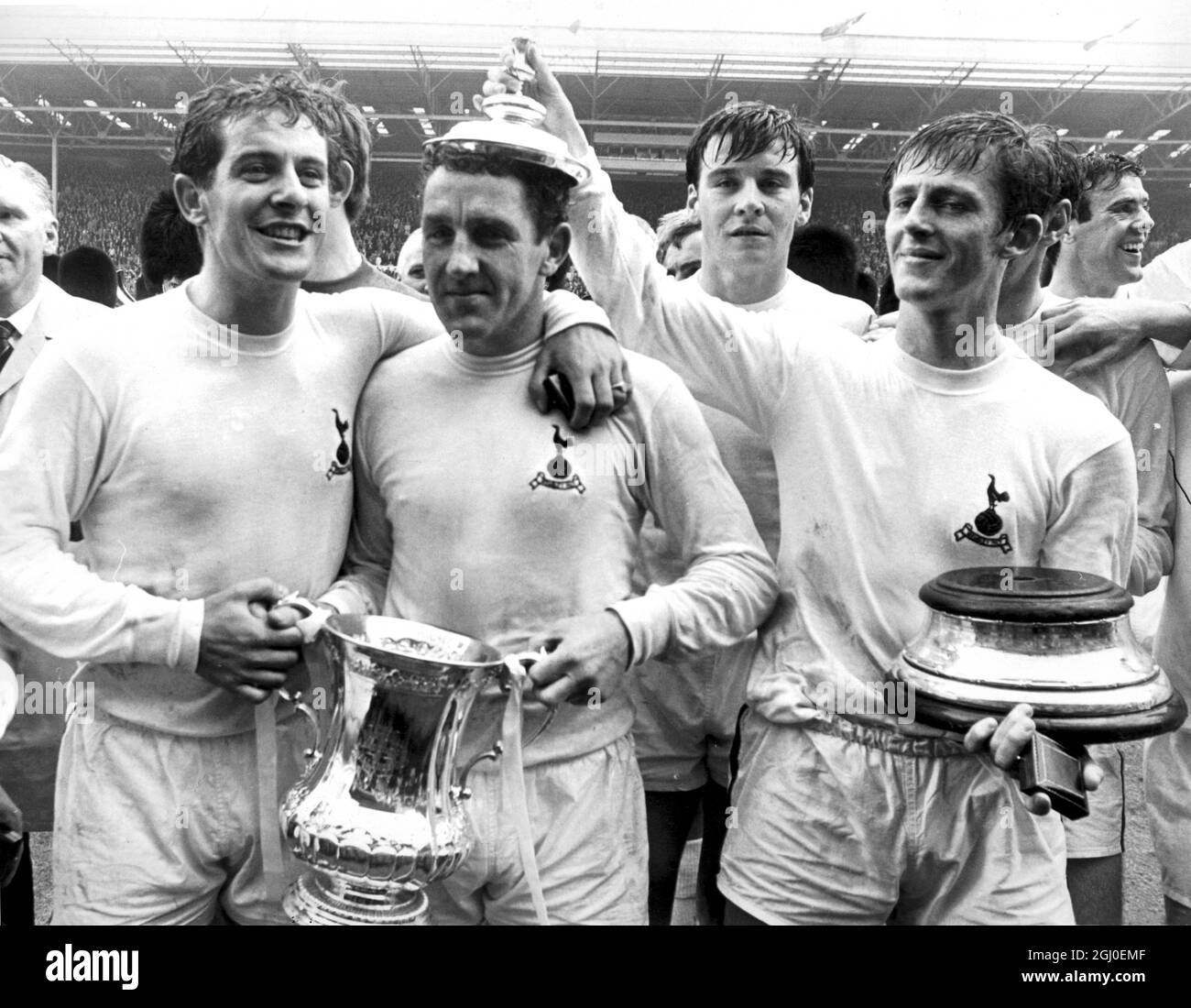 1967 FA Cup Final Chelsea v Tottenham Hotspur Spurs captain Dave Mackay is crowned by team-mate Jimmy Robertson (right) afterTottenham had defeated Chelsea by 2-1 in the FA Cup Final at Wembley. 20th May 1967. Stock Photo