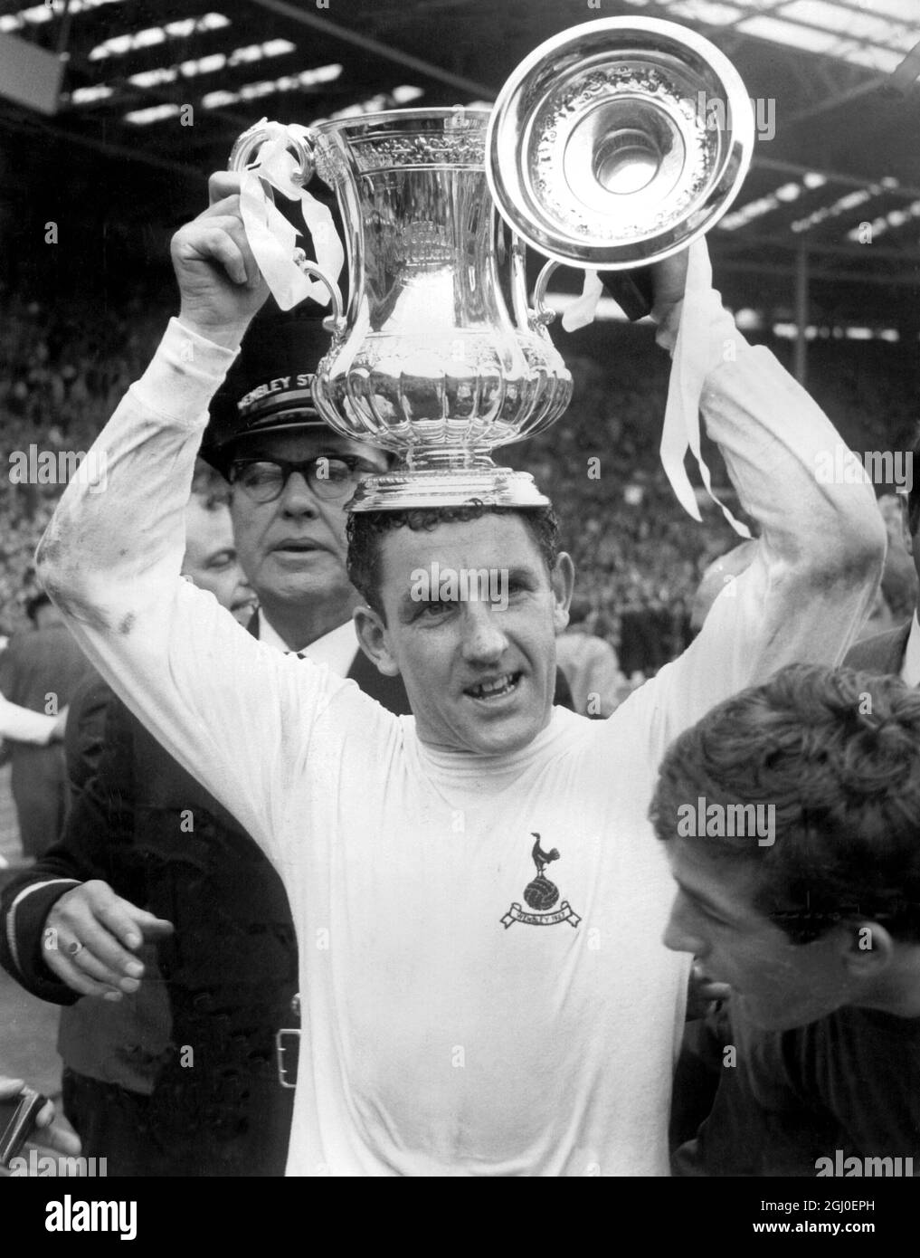 1967 FA Cup Final Chelsea v Tottenham Hotspur Dave Mackay, the Spurs captain holds the FA Cup over his head after the presentation by H.R.H. The Duke of Kent. Tottenham defeated Chelsea 2-1 to win the 1967 FA Cup Final. 20th May 1967. Stock Photo