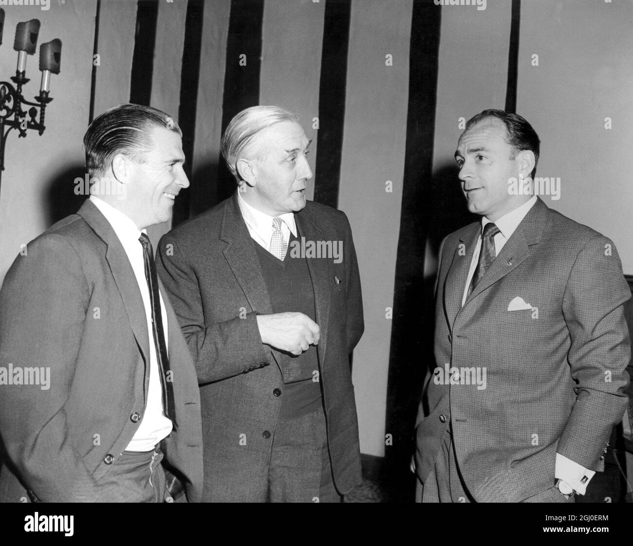 Mr Arthur Rowe (centre) manager of Crystal Palace with two of Real Madrid's football stars Ferenc Puskas (left) and Alfredo Di Stefano (right), at the reception of the Park Lane Hotel. Real Madrid will play Crystal Palace in a friendly match at Selhurst Park. 16th April 1962. Stock Photo
