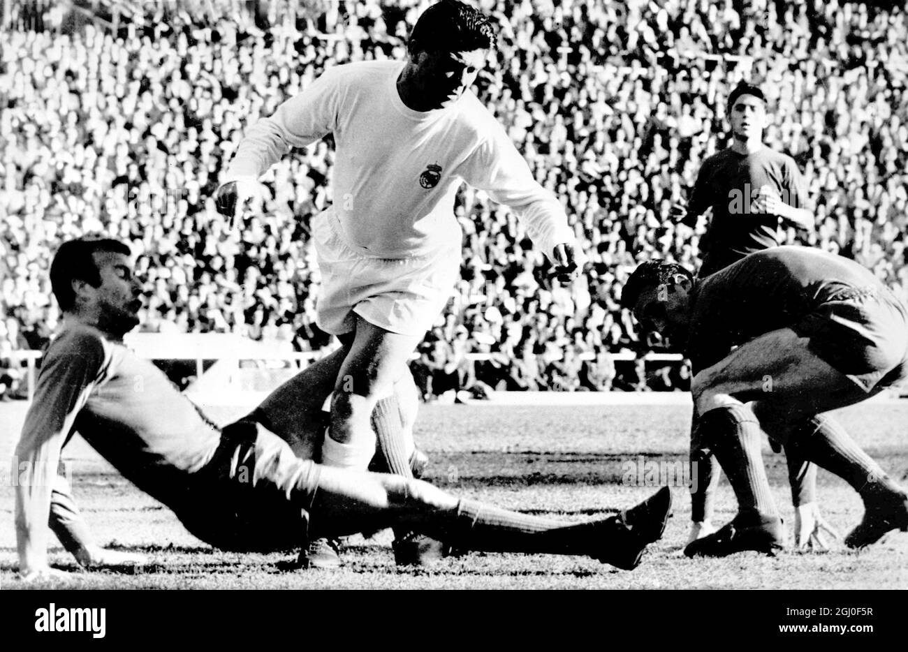 Hungarian exile Ferenc Puskas (in white) who now plays for Real Madrid is pictured in action during a 1962 match between Real Madrid and Oviedo. Stock Photo