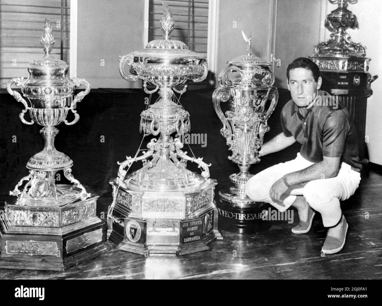 Real Madrid captain Francisco Gento, with the first three trophies of his team in the present season. From left to right, the Mohamed V Cup won in Casablanca; the Ramon de Carranza Cup won in Cadiz and the Teresa Herrera Cup won in La Coruna. 7th September 1966. Stock Photo